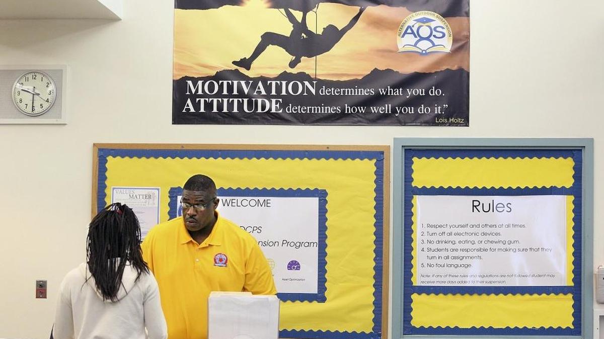 Maxie Graham, a site coordinator at the Success Center at 6300 NW 27th Ave. in Miami, reviewed a student's classwork at the start of the school year last September. The center was one of 10 that Miami-Dade County schools set up as an alternative to out-of-school suspensions in the first year of an ambitious overhaul of the district’s discipline program.