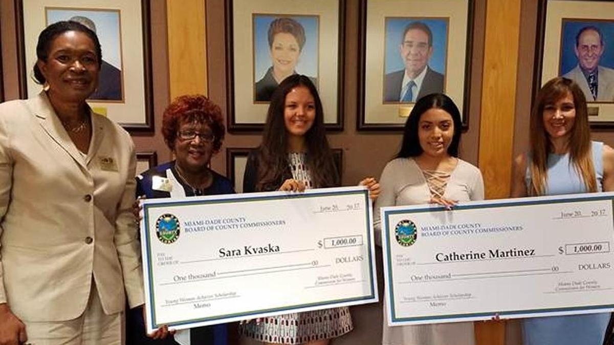 The Miami-Dade County Commission for Women recently awarded $1,000 scholarships to Sara Kvaska, left center, Catherine Martinez, right center, and Patricia Garcia, not pictured. The scholarship winners are pictured with Marie Woodson, chair of the commission, Beverly Nixon, member of the commission, and Monica Interian, second vice chair of the commission.
