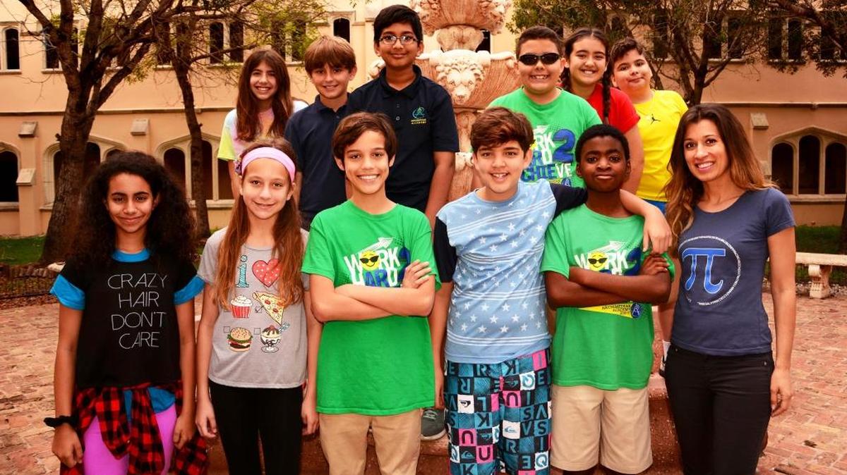 Fifth grade students of Archimedean Academy were named finalists in the Pi Math Contest, and will compete in the final round against students from California, Nevada, Massachusetts, and Florida on April 29. Students are pictured with their teacher, Alexandra Georgiou.