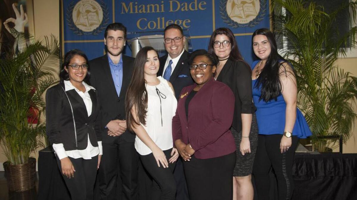 I AM MDC scholarship recipients pose at Tuesday’s ceremony. From left to right: Jasmine Cano, Daniel Aguiar, Eugenia De Gregorio, CEO and President of Brickell Motors Mario Murgado, Cassandra Felix, Alyssa Zayas-Bazan and Natali Perez.