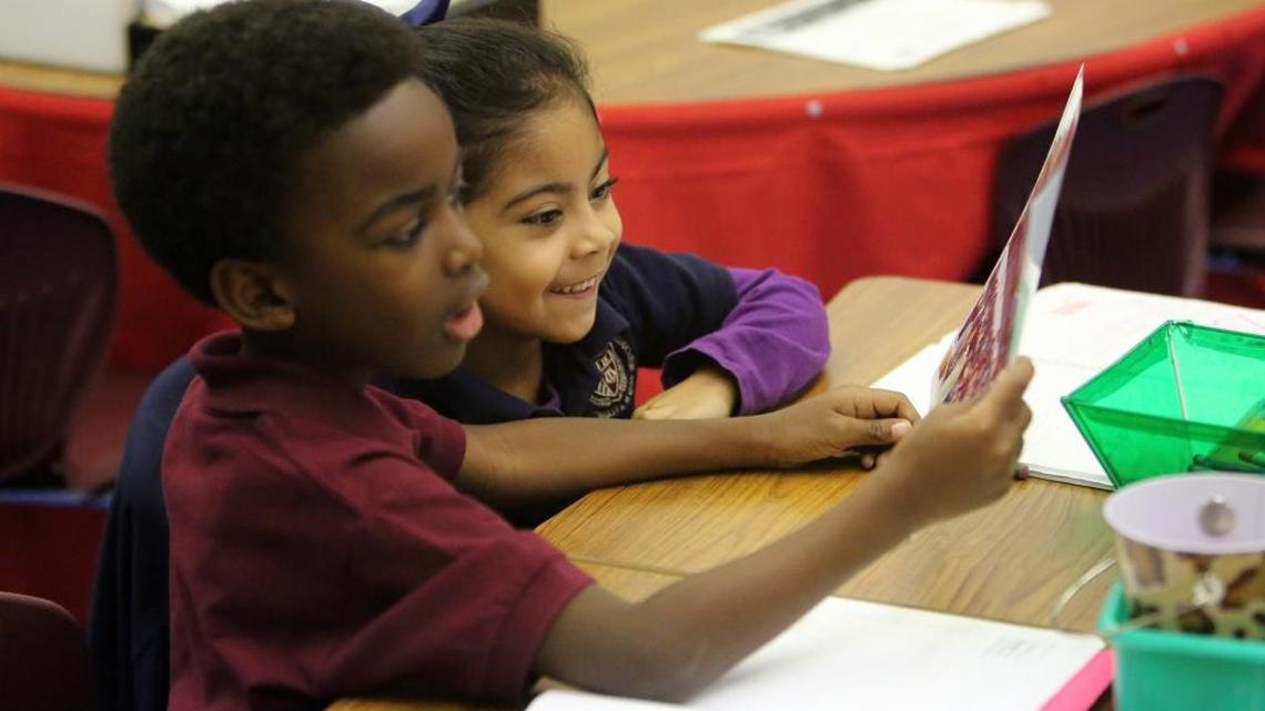Kindergarten students Gregory Antoine and Kaylee Monteagudo at AIE Charter School in Miami Springs.