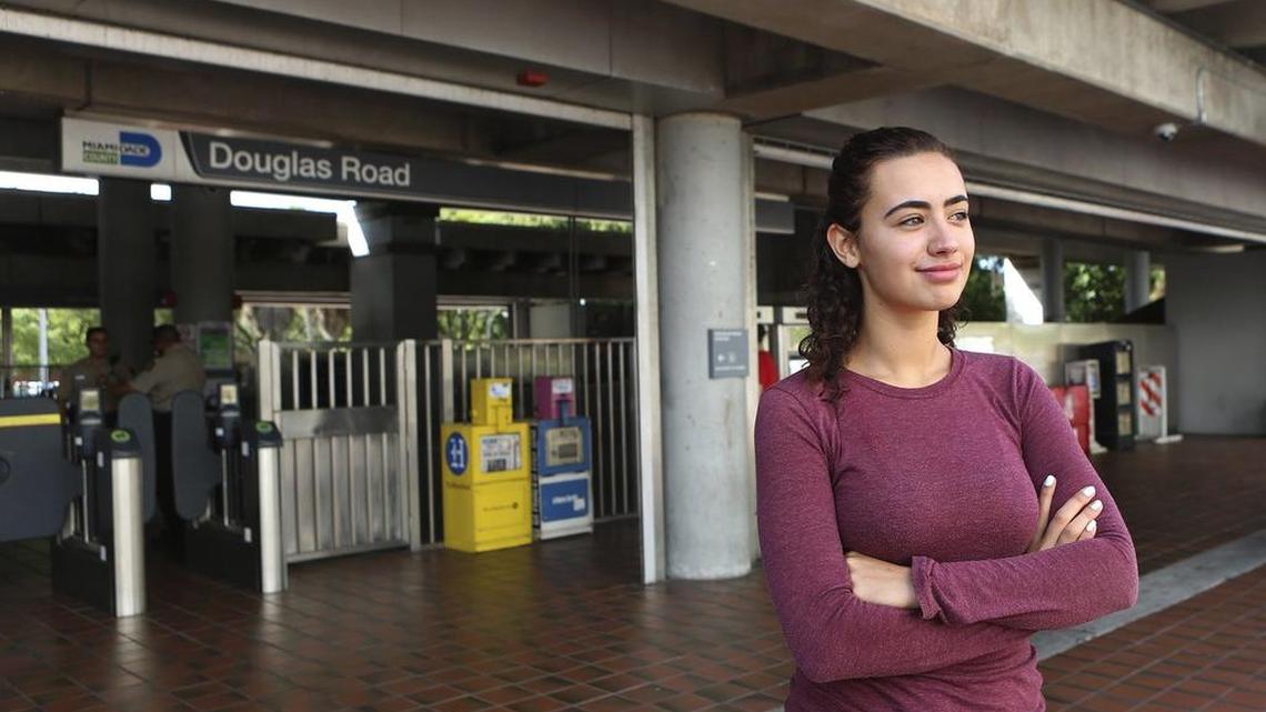 
Jessica Mion stands outside the Douglas Road Metrorail station near her Coral Gables home on Friday, Aug. 7, 2015. The station, at 3060 SW 37th Ct. in Coral Gables, is one link in her commute to Coral Reef Senior High School, where Jessica, 16, is a rising senior. Jessica's total daily commute includes a drop-off by her parents, two Metrorail rides, a school bus, the Coral Gables Trolley and sometimes a county bus. 
