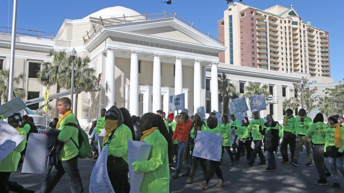 Demonstrators march by the Florida Supreme Court building as they rally in support of the school voucher program on Tuesday, Jan. 19, 2016, in Tallahassee. An appeals court rejected a challenge to Florida’s de facto school-voucher system on Tuesday, Aug. 16, 2016, setting up a potential Supreme Court battle.
