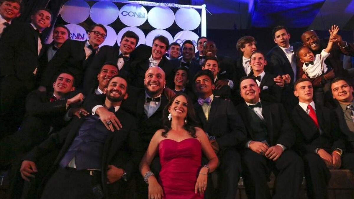 Student, teachers and news reporters take a group picture during the third annual Media Excellence Awards at Christopher Columbus High School on Saturday, April 16, 2016. The ceremony is presented by the Christopher Columbus News Network, which is run by high school students.