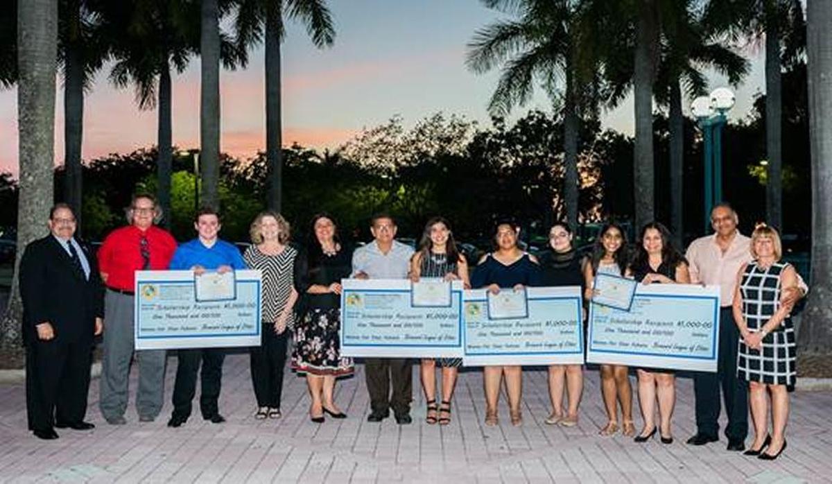 The Broward League of Cities awarded $1,000 scholarships to Sierra Molina of Pompano Beach High School; Zak Myers of South Broward High School; Rina Laklahlani of Nova High School; and Joanny Vazquez of the College Academy at Broward College. These students were awarded based on their leadership skills, academic performance, and their interest in government-related careers. The winners are pictured with Greg Ross, president of Broward League of Cities; Gordan and Luann Myers, parents of Zak; Musa and Miguel Molina, parents of Sierra; Karina Vasquez, mother of Joanny; Raksha and Nilesh Laklahlani, parents of Rina; and Shelley Eichner, co-chair of the Youth Leadership Committee.