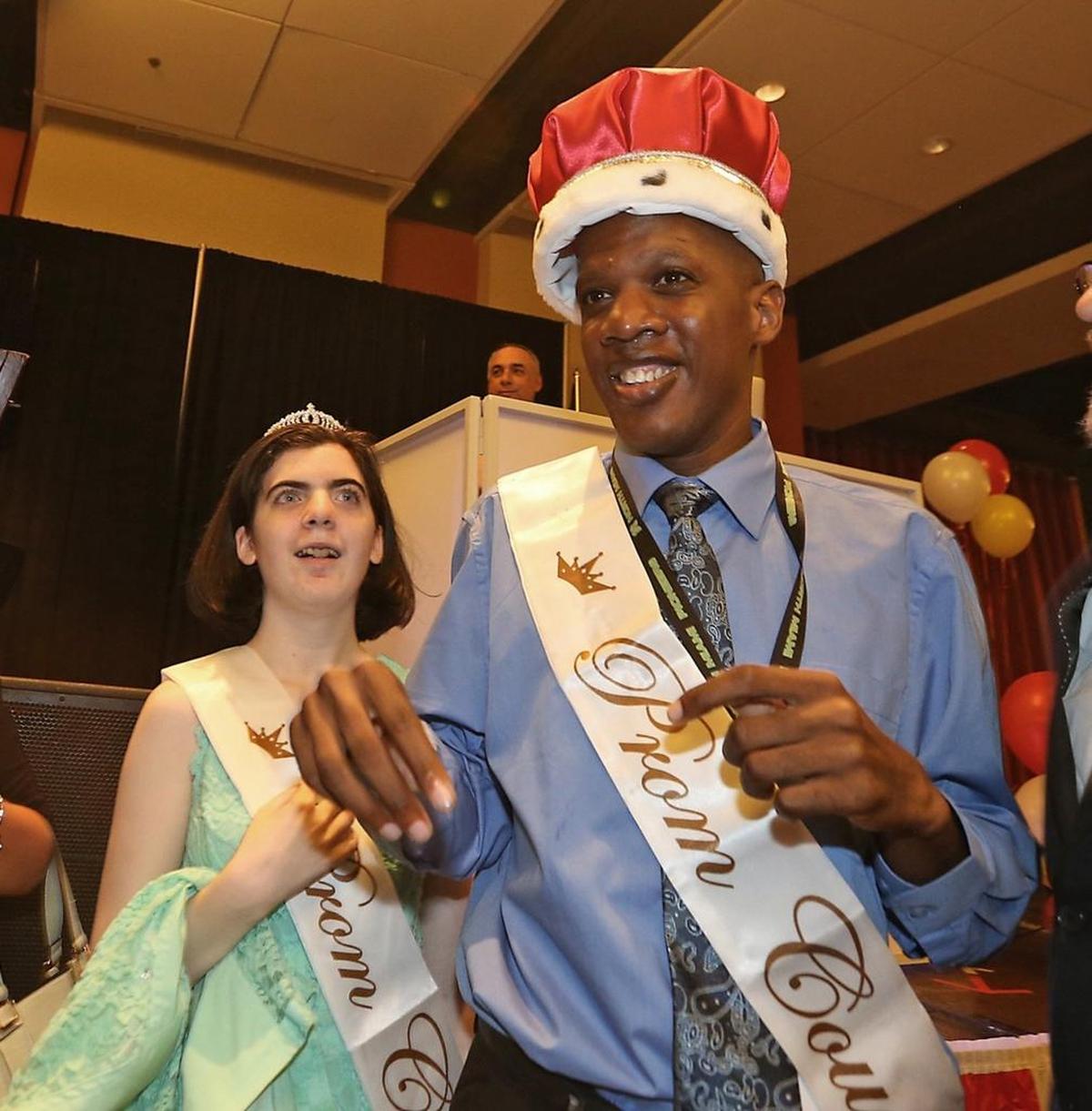 Prom Queen Lisa Sprung of Miami Coral Park Senior High and Prom King Kiano Crossgill of North Miami Senior High School celebrate in front of 400 other high school students at a prom for those with autism spectrum disorder at the DoubleTree by Hilton Miami Airport & Convention Center on Tuesday, May 16, 2017.