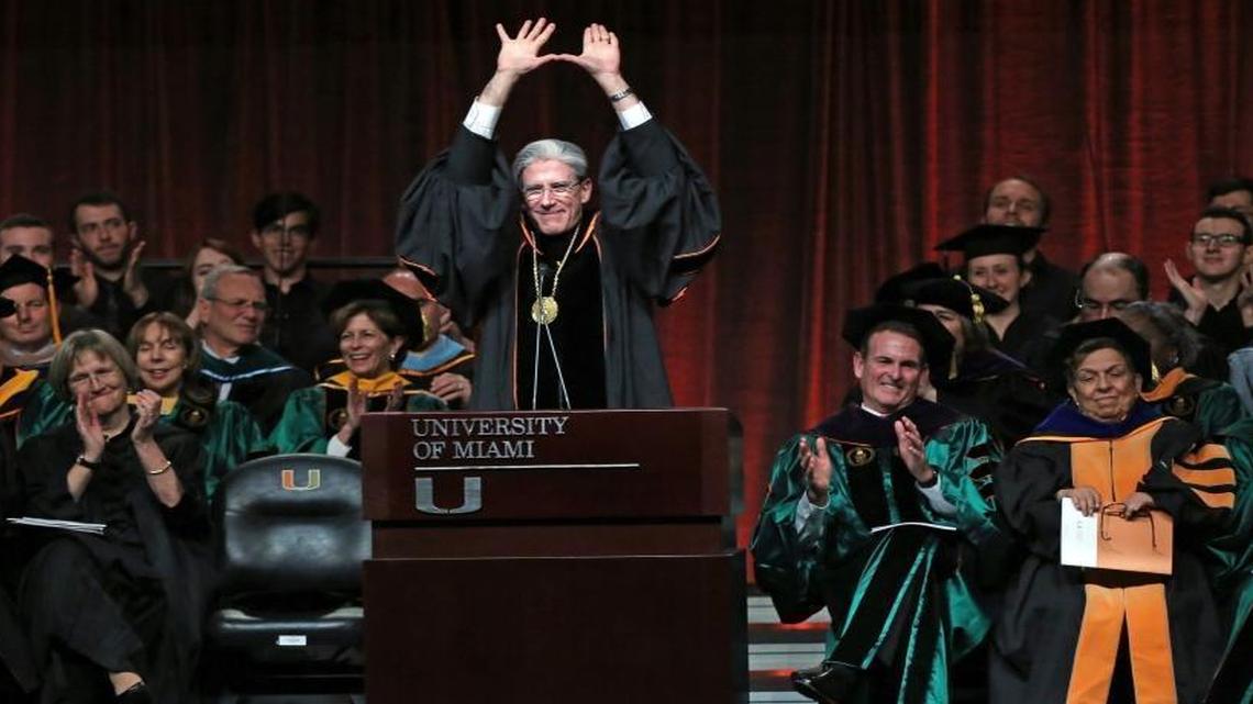 Julio Frenk throws up the 'U' after he is installed as the sixth president of the University of Miami at the BankUnited Center, Friday, Jan. 29, 2016.