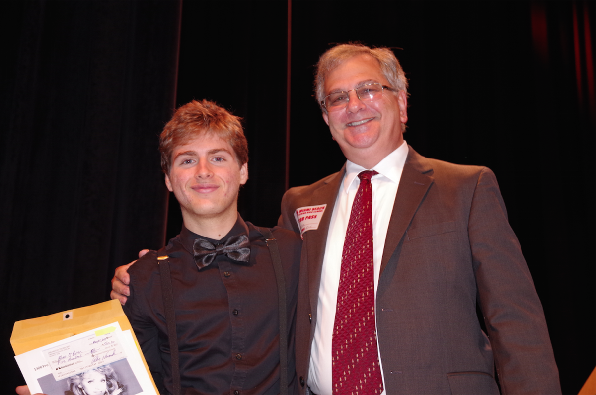 Bleu O’Brien, left, of Miami Beach High School received the 2017 Carole Taran Award by 1308 Productions for his achievements in performing arts. He is pictured with Paul Novack, right, Taran’s brother and a representative of 1308 Productions.