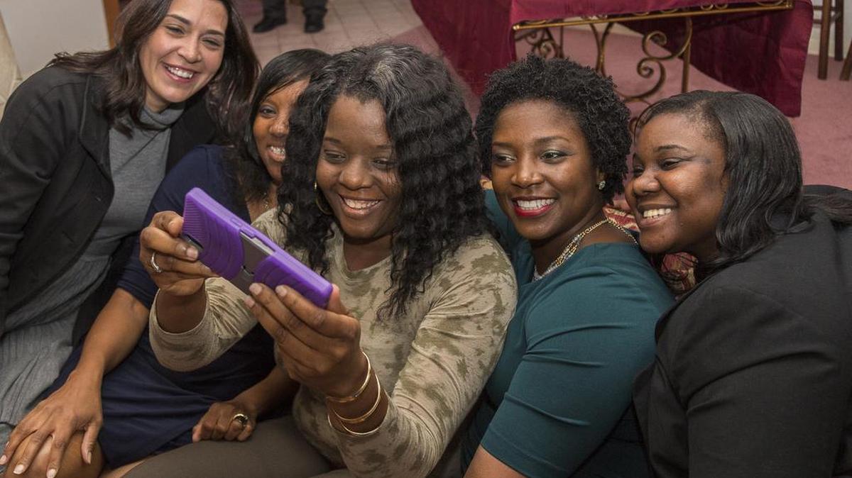 The 2017 Miami-Dade Francisco R. Walker Teacher of the Year finalists take a selfie while celebrating their nominations. From left to right: Michelle Kelly, Gina Graham, former finalist Tawana Akins, Lema Gilliard and Precious Symonette.