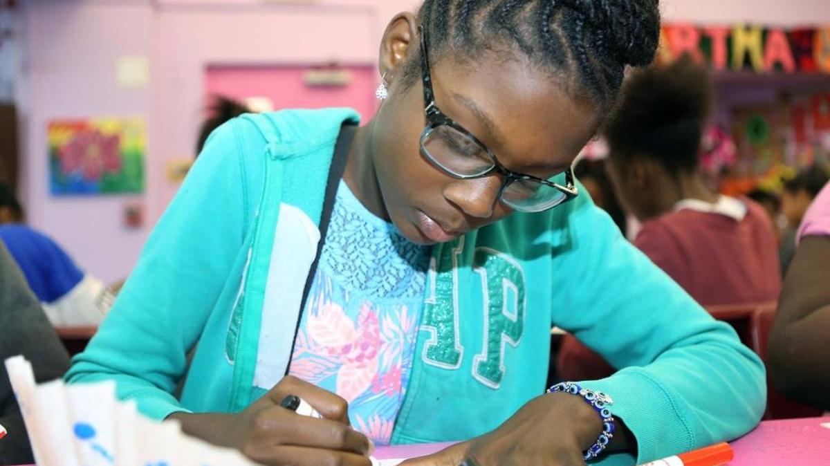 Kourthey Sherrod draws at the Culmer Community Action Center on Monday, June 27, 2016, as part of the Perez Art Museum's summer program neighborhood kickoff.