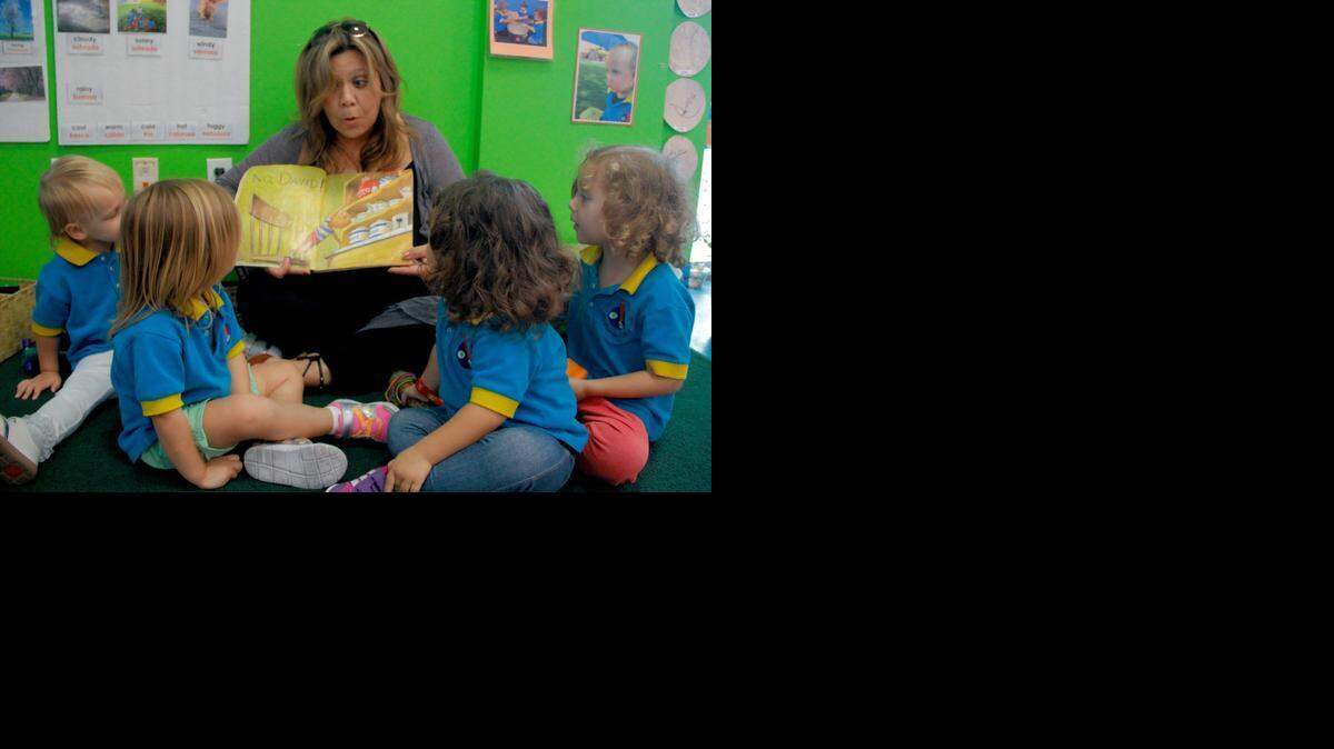 
Miami Children's Museum early childhood teacher Ana Luz Garcia reads to students on Wednesday, April 8.
