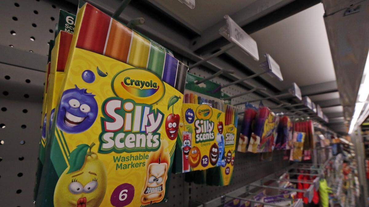 A display of scented markers, and crayons in a Staples.