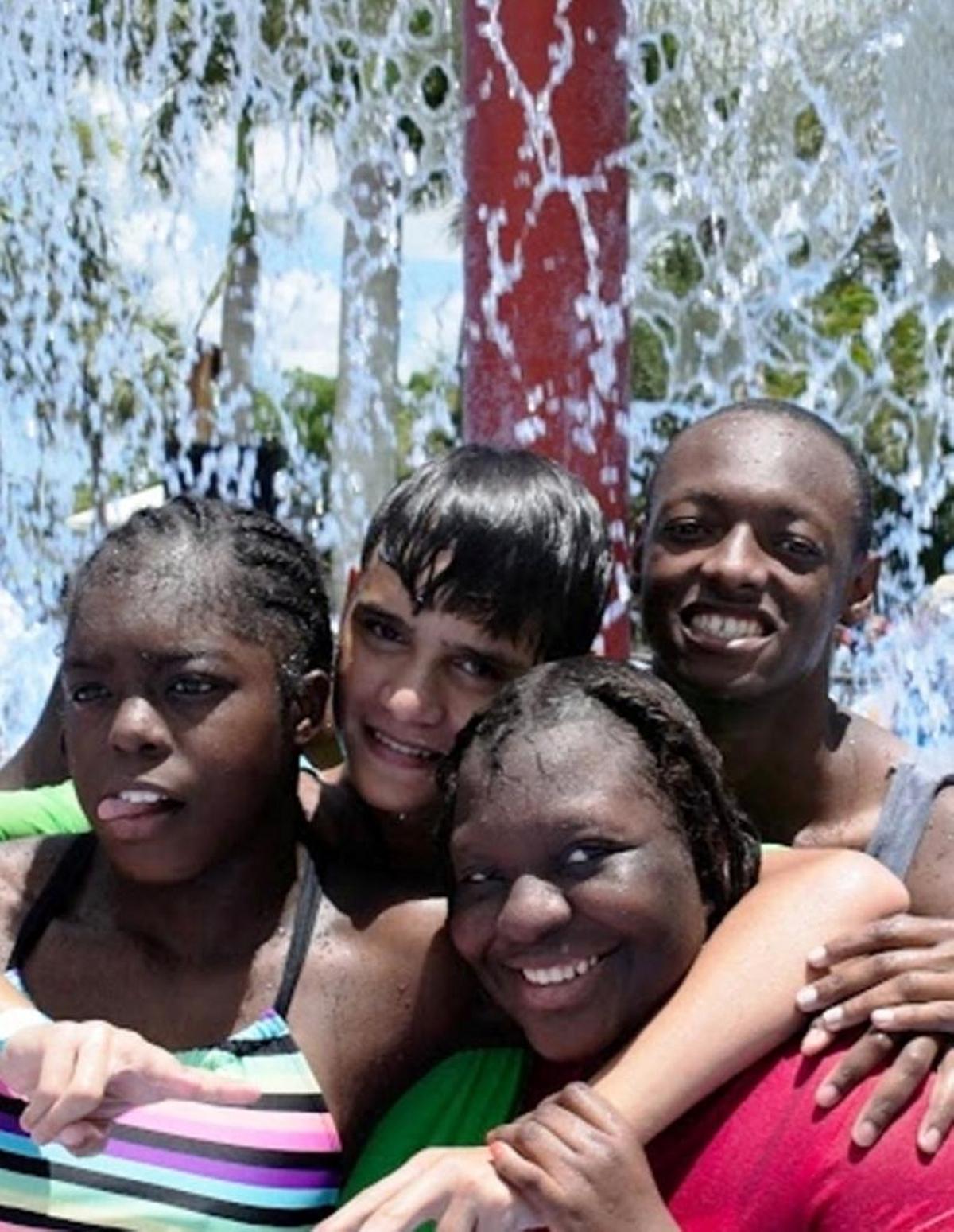 Hope for Miami campers enjoy the water during their summer break from school.