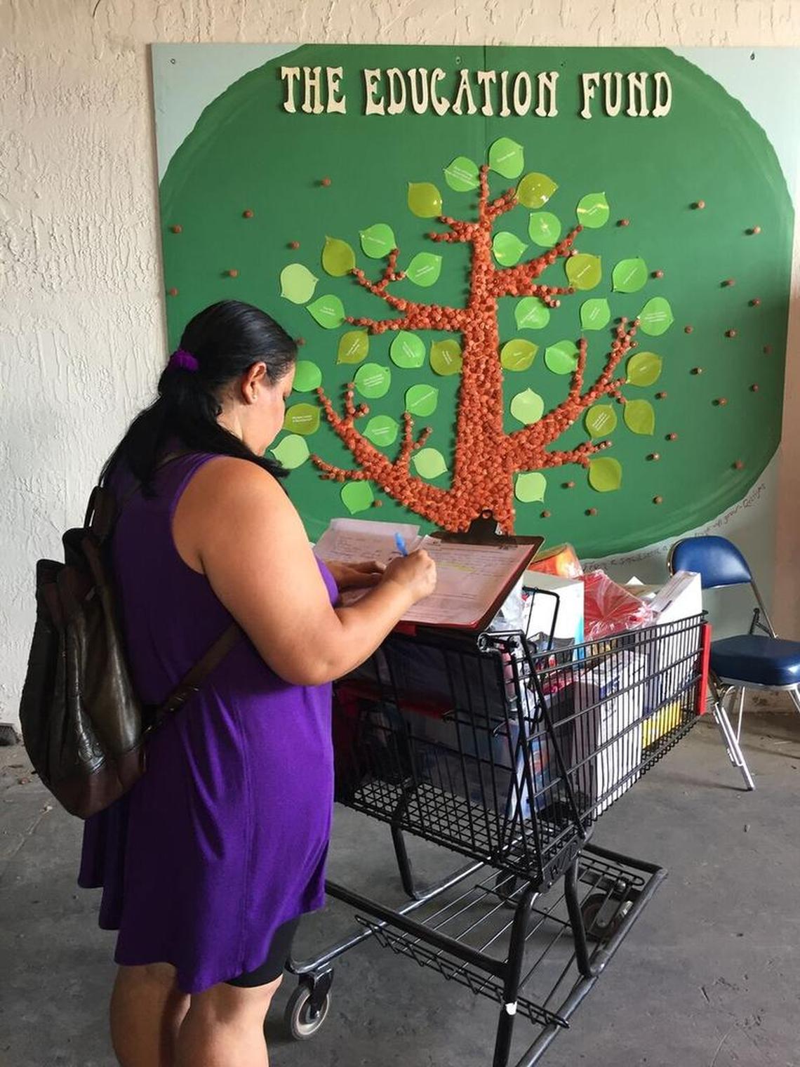 A teacher shops for school supplies at The Education Fund’s Ocean Bank Center for Educational Materials.