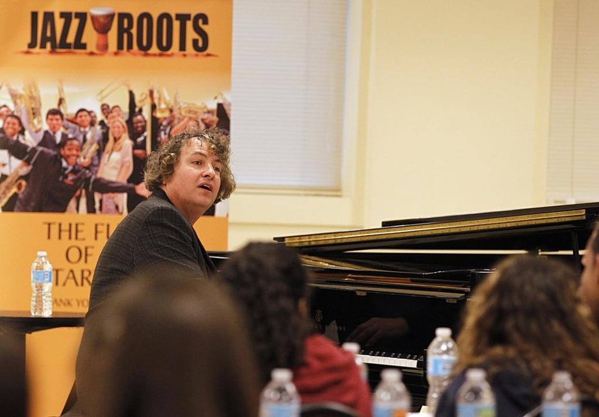 James Gasior, professor at New World School of the Arts, demonstrates blues music to a group of students from Miami-Dade at the Jazz Roots series at the Adrienne Arsht Center for the Performing Arts on April 07, 2017.