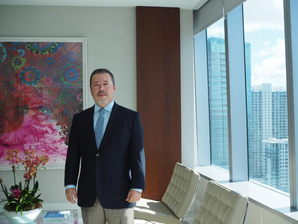 Joseph Fernandez, president of BNY Mellon’s Florida operations, poses for a photo in the banking and investment company’s Miami office on Brickell Avenue. He said he plans to offer internships to Cristo Rey high schoolers when the school opens in 2020.