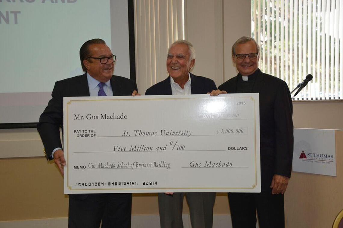 From left, St. Thomas University board chairman John Dooner, Gus Machado and the Rev. Monsignor Franklyn Casale on July 1, 2015. Machado and wife Lilliam gave $5 million to the Catholic school in Miami Gardens to establish a business school in Machado’s name.