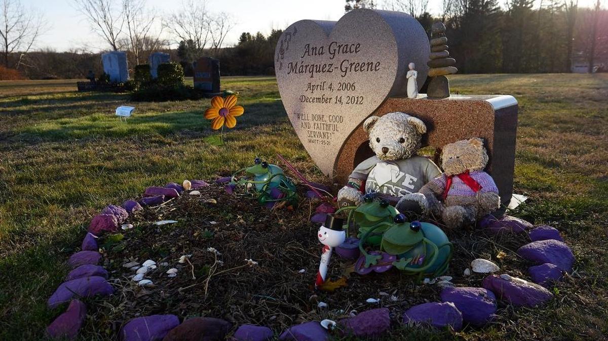 Graves of victims of the Sandy Hook Elementary School buried at Newtown Village Cemetery on Wednesday, Nov. 29, 2017, in Newtown, Conn.