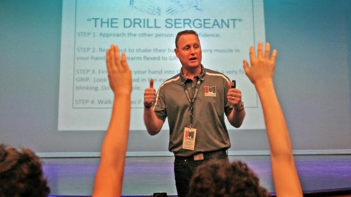 Bestselling author Jonathan Catherman looks for volunteers from Aventura City of Excellence School to demonstrate a proper handshake at the Aventura Arts & Cultural Center on Wednesday, March 1, 2017.