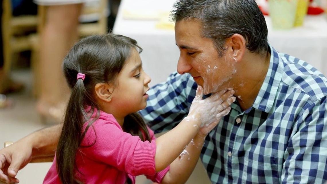 Visually impaired Daniela Abreu, 5, puts shaving cream on her dad Alan Abreu’s face as The Art of Shaving visits the Lighthouse Learning Center for Children for a pre-Father's Day shaving event on Wednesday, June 7, 2017.