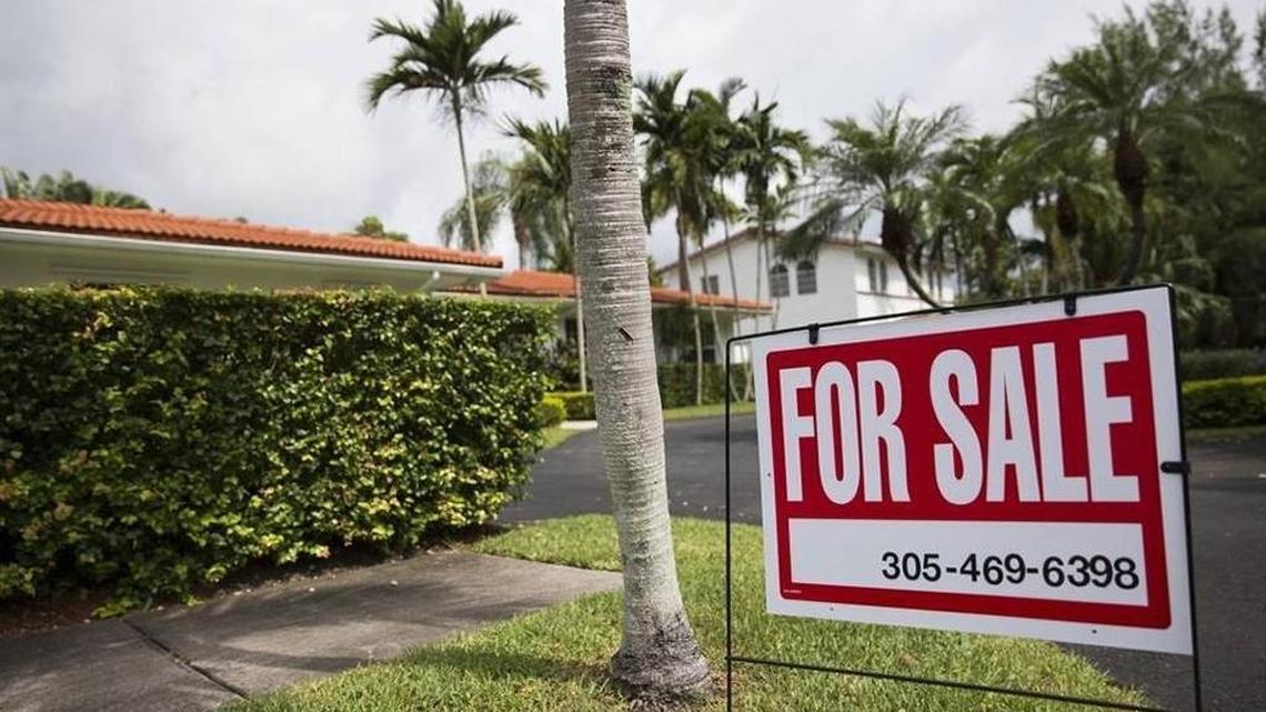 A sign posted outside a home for sale on Southwest 112th Street in Pinecrest on Wednesday, June 10, 2015.