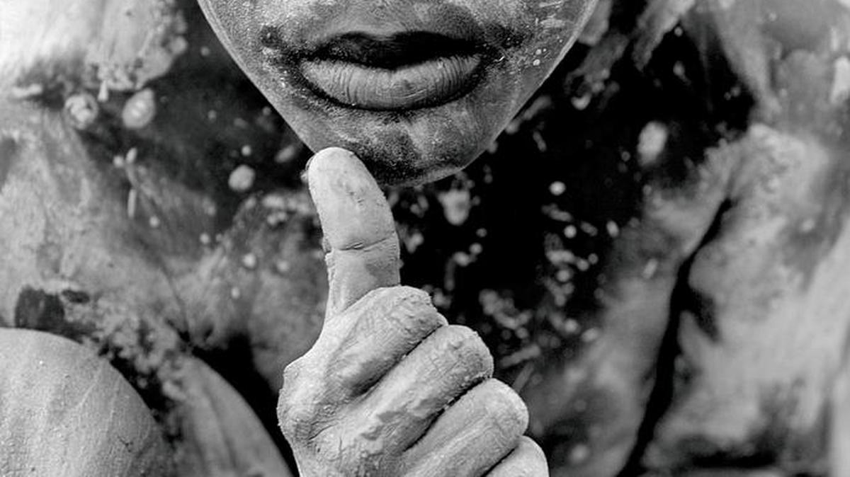 Haiti — long ranked as the poorest nation in the Western Hemisphere — saw its people buckle under the cruelty of a merciless hurricane season in 2008. Four consecutive storms slammed the island nation, leaving in their wake staggering death tolls and massive destruction to an already-frail way of life. Seven-year-old Sonson Pierre sits in knee deep mud outside his family's flooded home in Gonaives, Haiti, Sept. 4, 2008, days after several storms including Tropical Storm Hannah hit the country. This is one of the photos shot by Miami Herald photographer Patrick Farrell, who won a Pulitizer Prize for feature photography in 2009.