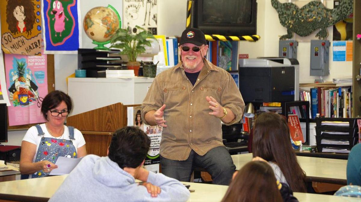 Australian artists Donna Sharam, left, and Graeme Stevenson, right, visit art students of Barbara Goleman High School to talk about their career paths, and the business model behind making art a profession.