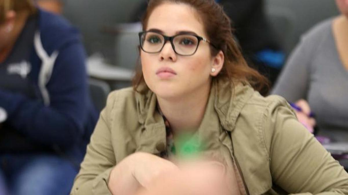 Maylin Castillo listens during a class for students who want to become teachers at Miami Dade College earlier this month. There is a national teach shortage.