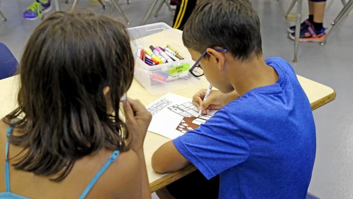 A summer student does art work at Paul Bell Middle School. The school offers Florida International University's Center for Children and Families program, Summer Treatment Program.