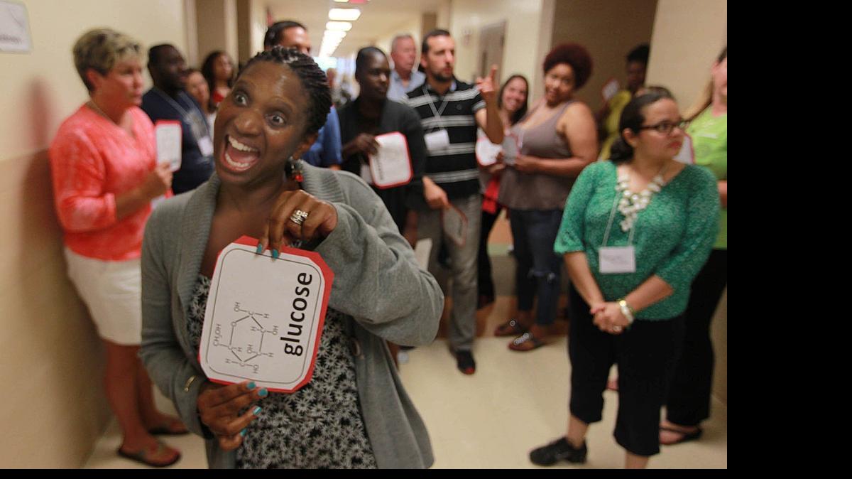 
Miami-Dade County teacher Kenyatla McKie participates in a lesson about how the body makes energy. She was part of a group of science and math teachers getting training this summer.
