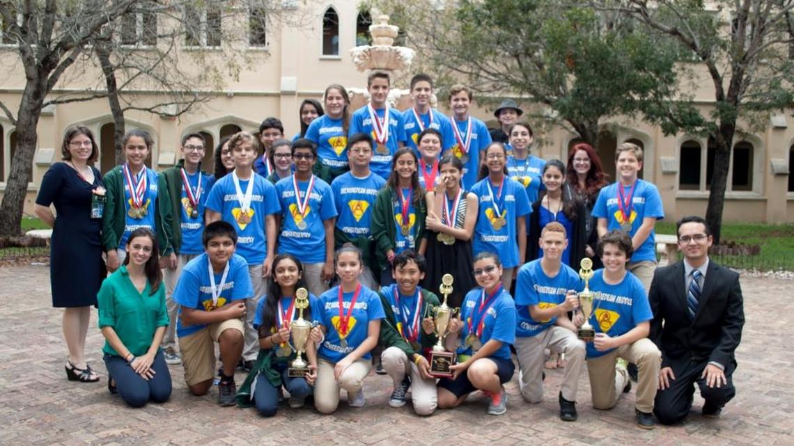Students at Archimedean Middle Conservatory, a Greek-based K-12 charter school in Southwest Miami-Dade County, show off their trophies.