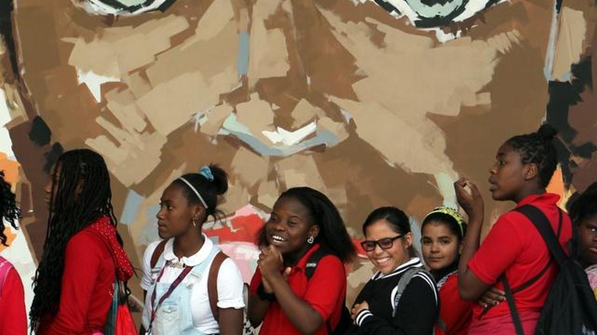 Jose de Diego Middle students line up in front of a mural painted at the Wynwood school.