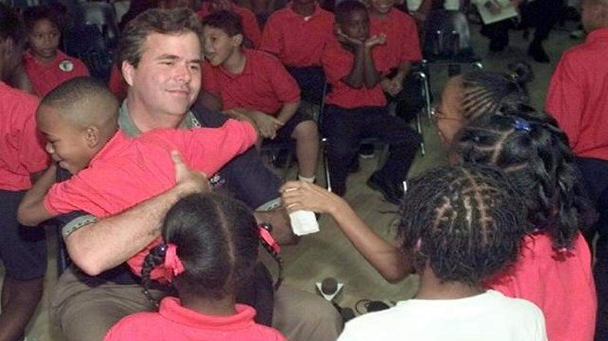 
Then Gov.-elect Jeb Bush gets a hug from 8-year-old David Tice during a visit to the Liberty City Charter school on Nov. 4, 1998.
