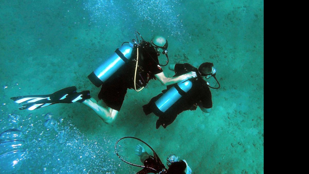 
Jim Elliott, left, president of DIVEHEART, buddies with Joseph Deslauriers, 36, wounded Air Force retired vet. They dive off the Fort Lauderdale coast checking on coral with Nova Southeastern University College of Natural Sciences and Oceanography and DiveBar, Wednesday June 24, 2015. Deslauriers lost one arm and both legs in a land mine explosion.
