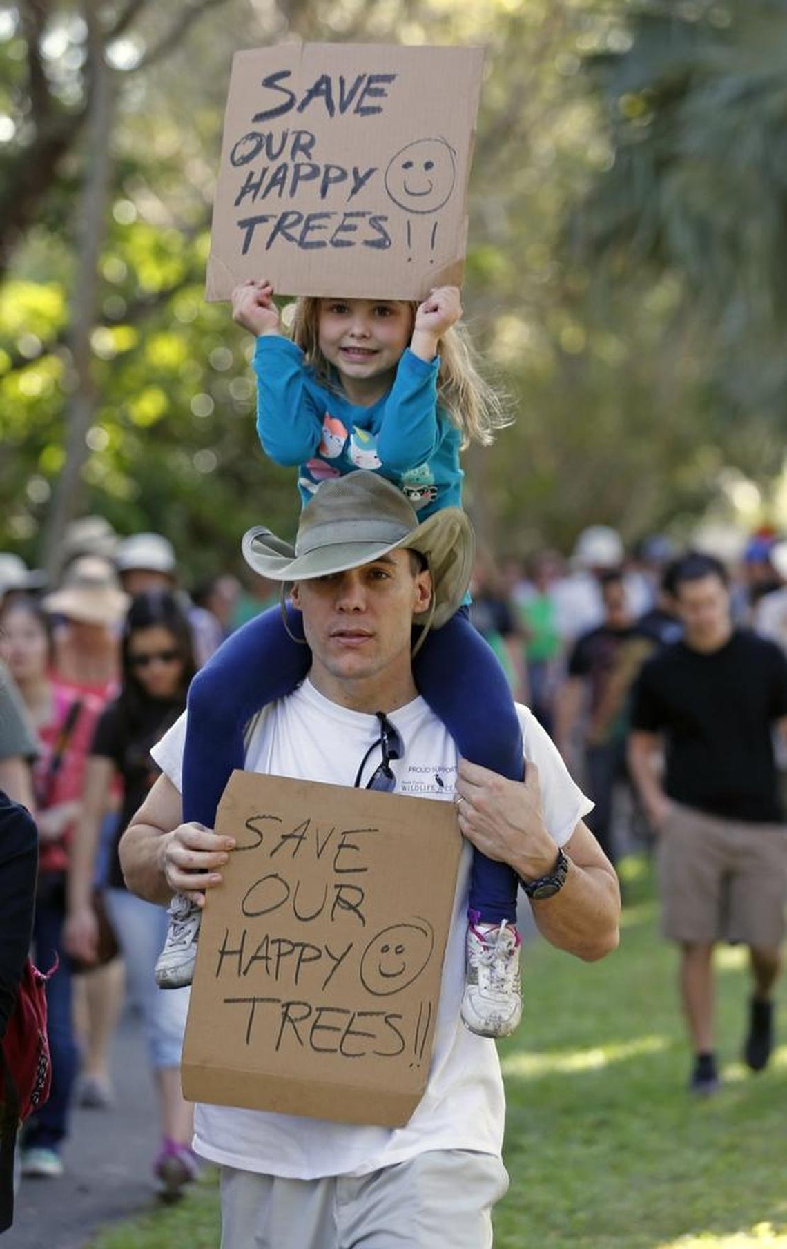 Sean Atkinson, with daughter Katherine Atkinson, 5, protested plans to build the shopping center in January 2015.