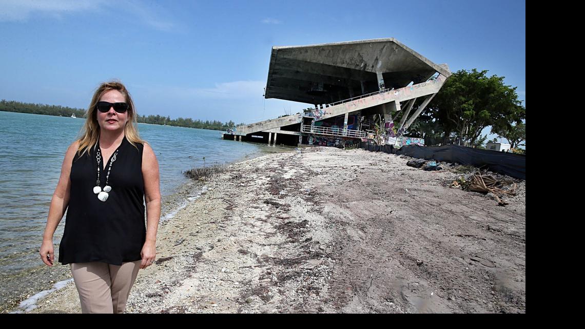 
Mayra P. Lindsay, Mayor of Village of Key Biscayne, stands in an area along the shoreline where protected mangrove trees had been cut down illegally without a permit, next to the Marine Stadium by contractors hired by the City of Miami to work on the stadium and the surrounding areas. County inspectors last month found about 2,000-square feet of red and black mangrove tree canopy had been cleared. The Mayor has bitterly opposed putting the boat show at the stadium, says the blunder indicates how little prepared the city is to be ensure the show doesn't damage fragile sea grass beds and other marine life in a nearby marine reserve in Key Biscayne, on Friday, June 26, 2015.
