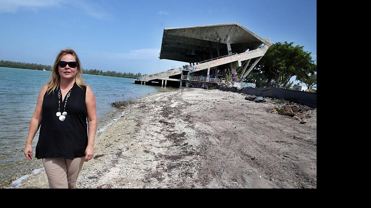 
Mayra P. Lindsay, Mayor of Village of Key Biscayne, stands in an area along the shoreline where protected mangrove trees had been cut down illegally without a permit, next to the Marine Stadium by contractors hired by the City of Miami to work on the stadium and the surrounding areas. County inspectors last month found about 2,000-square feet of red and black mangrove tree canopy had been cleared. The Mayor has bitterly opposed putting the boat show at the stadium, says the blunder indicates how little prepared the city is to be ensure the show doesn't damage fragile sea grass beds and other marine life in a nearby marine reserve in Key Biscayne, on Friday, June 26, 2015.
