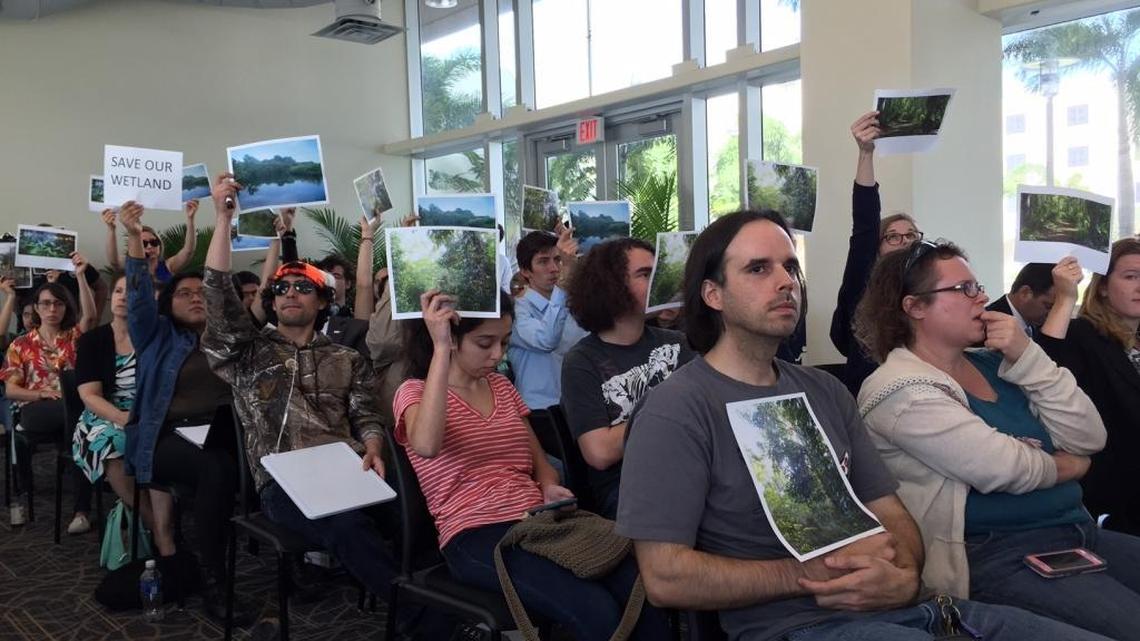Protesters objected Friday to Florida International University plans to build two football fields on part of the campus nature preserve.