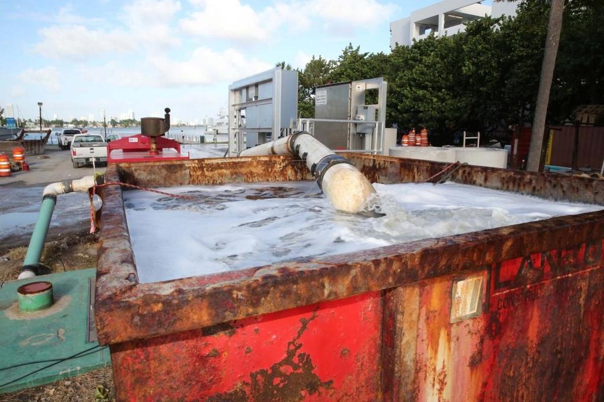 An anti-flooding water pump roars at full capacity at Maurice Gibb Park in the 1800 block of Purdy Ave. in Miami Beach due to the beginning of a king tide last October. Projects like these could become more expensive in cities that ignore the risks of climate change, according to a new report by credit agency Moody’s.
