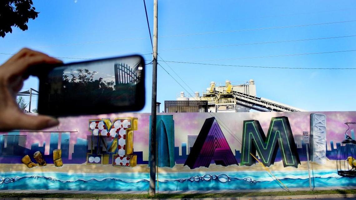 Miami Murals, a climate-focused mural series, unveils its first augmented reality mural on Saturday, Feb. 3, 2018, in front of the historic City of Miami Cemetery. The mural is brought to life through an app, which shows two alternate futures for the city.