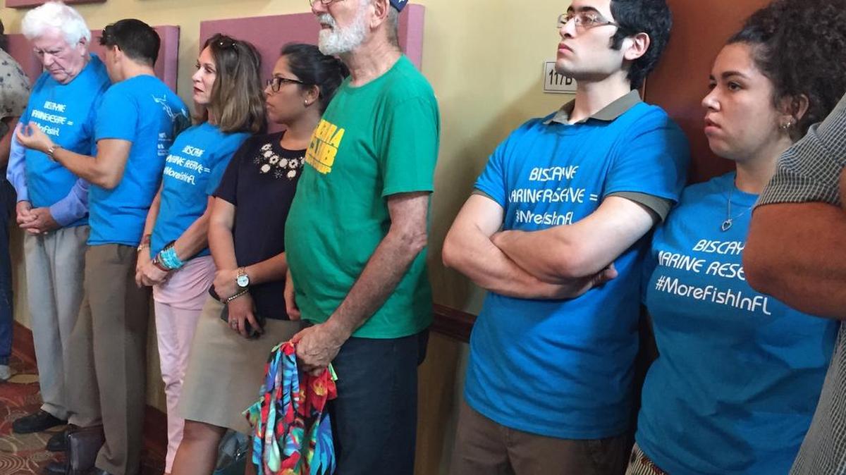 
Standing Room Only: Mark Bonaparte of Kendall, left, and Paul Nuñez of Miami Lakes and Haydee Borrero of Miami stand near the back of William F. Dickinson Community Center in Homestead, listening to testimony on the National Public Service’s “no fish” marine reserve in Biscayne National Park.
