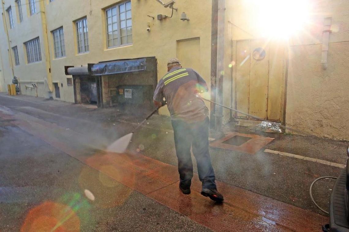 Miami Beach sanitation worker Melvin Gaitan cleaned an alley with water heated to 250 degrees during the height of last year’s Zika outbreak in August 2016. The hotwater can kill mosquito larvae.