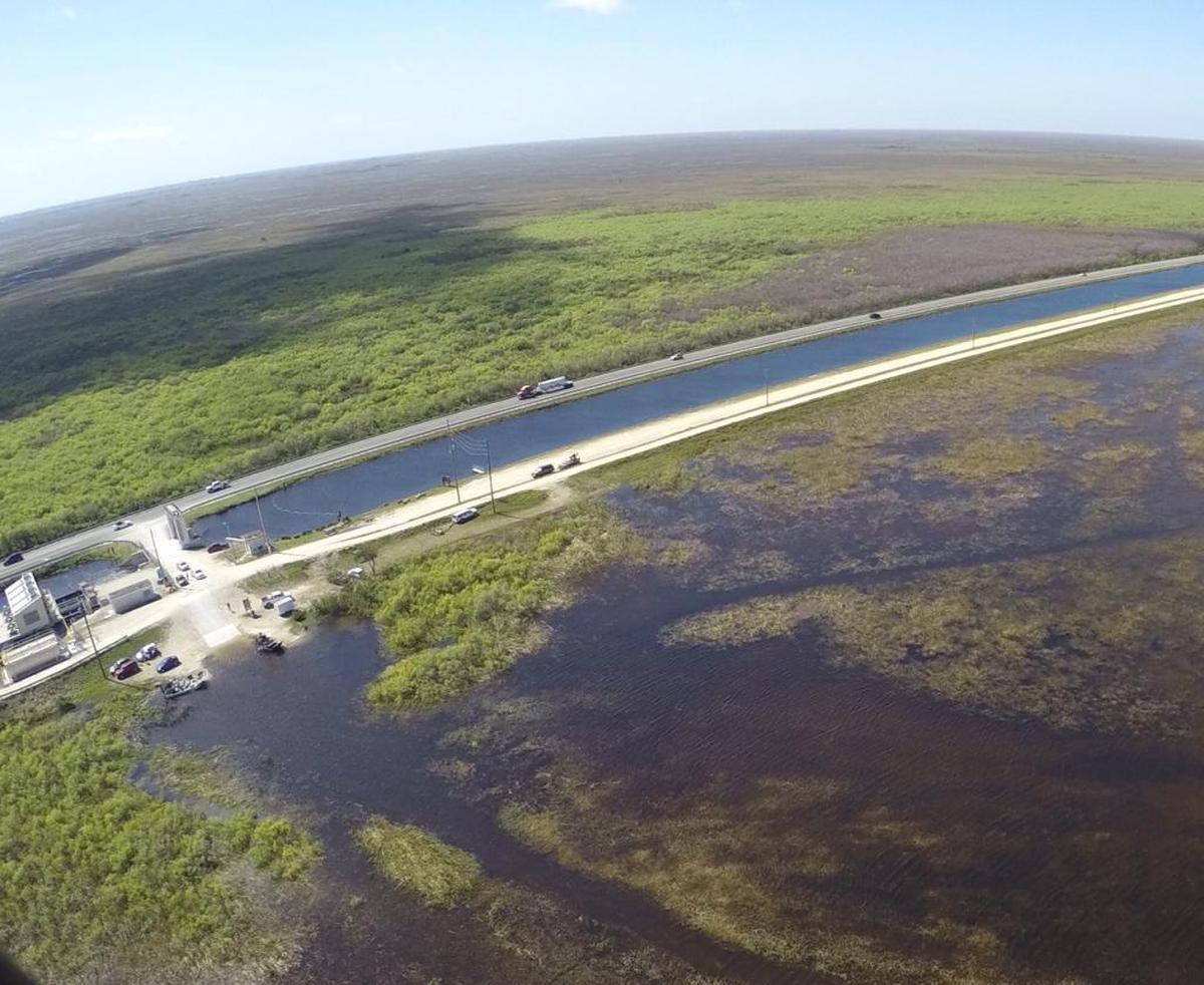 Record early wet season rain has prompted water managers to begin moving water out of flooded water conservation areas north of the Tamiami Trail, shown here during last year’s high water emergency, and into Everglades National Park.