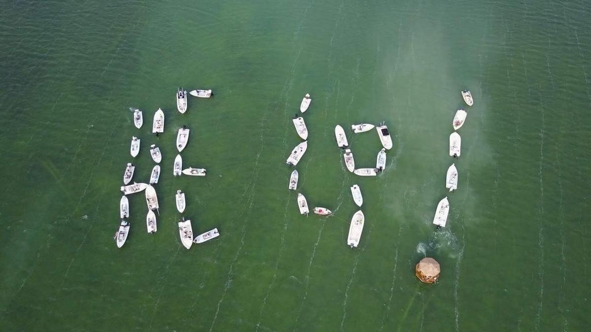 With winds blowing at more than 20 mph Thursday, skiffs and boats — and a floating tiki — lined up Thursday near Islamorada to send a message to lawmakers demanding help to improve waer conditions in Florida Bay.