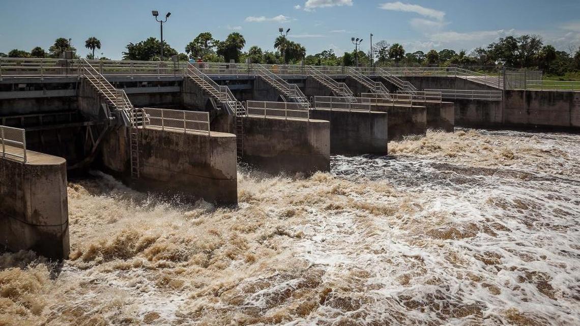 Water flows over the spillway at the St. Lucie Lock and Dam in Martin County, July 23, 2013.