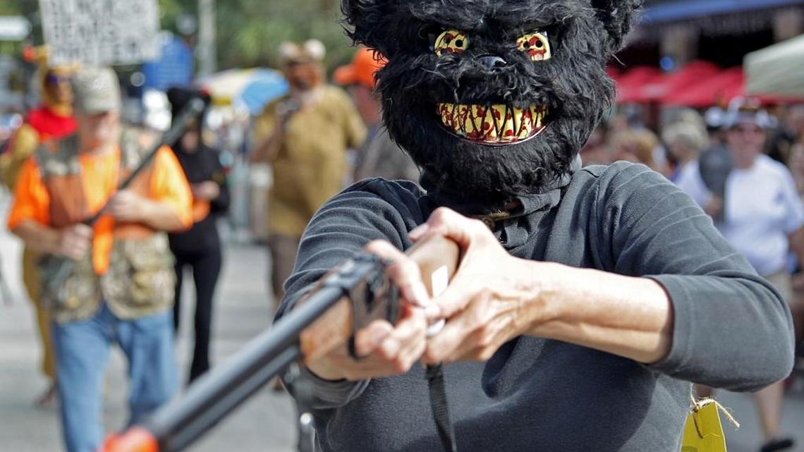 Critics of the bear hunt dressed as bears in the 2015 King Mango Strut in Coconut Grove in December.