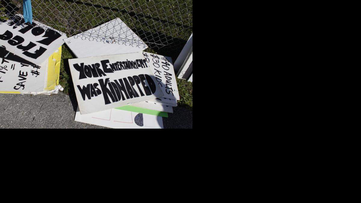 
People brought several signs to hold outside the Miami Seaquarium as they protested for the release of the orca Lolita on Saturday afternoon, Jan. 17, 2015 on Virginia Key.
