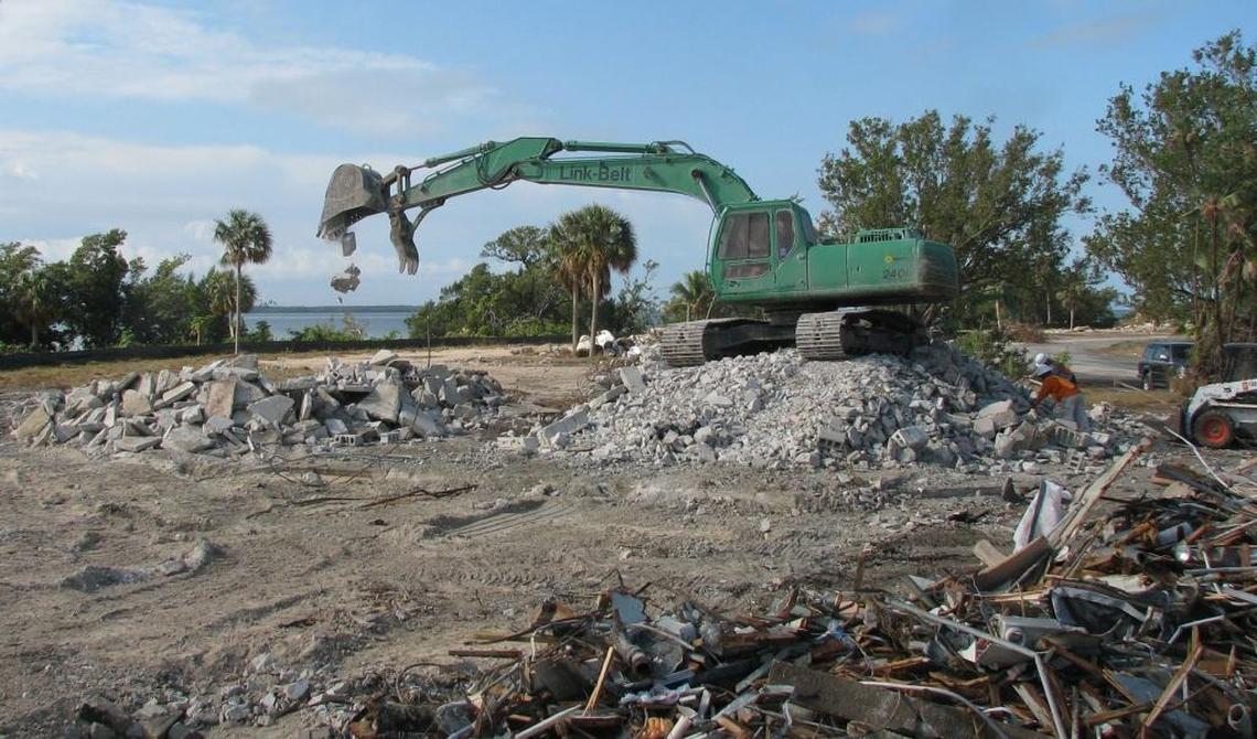 In 2009, front-end loaders scoop the remains of the Flamingo Lodge, a landmark hotel along Florida Bay in Everglades National Park. The hotel, built 50 years ago, was closed after back-to-back whacks from Hurricanes Katrina and Wilma in 2005.