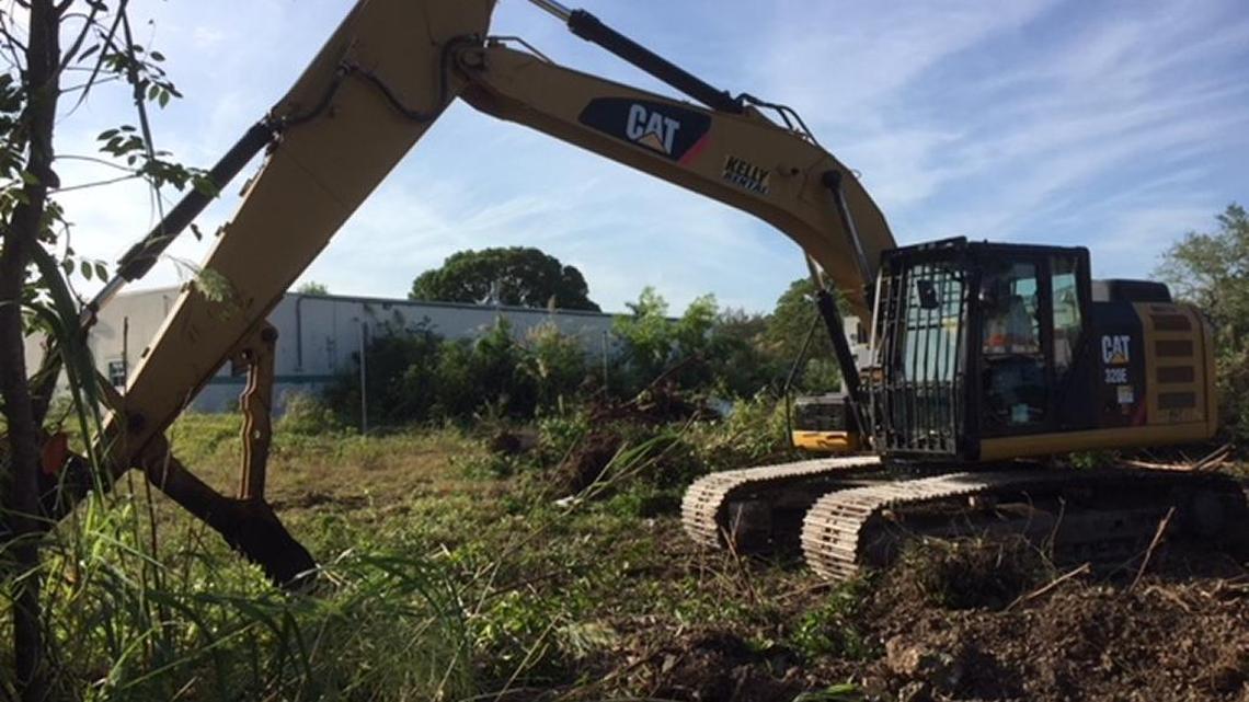 Miami Pine Rockland Coalition founder Al Sunshine photographed a bulldozer on Friday, Dec. 8, 2017, clearing trees and brush on pine rockland targeted for a shopping mall and 900 apartments.