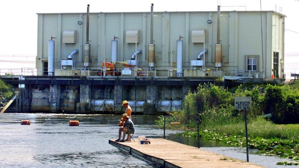 
Two anglers fish off a dock in Broward County near one of the massive pump stations operated by the South Florida Water Management District, the largest district in the state covering 16 counties.
